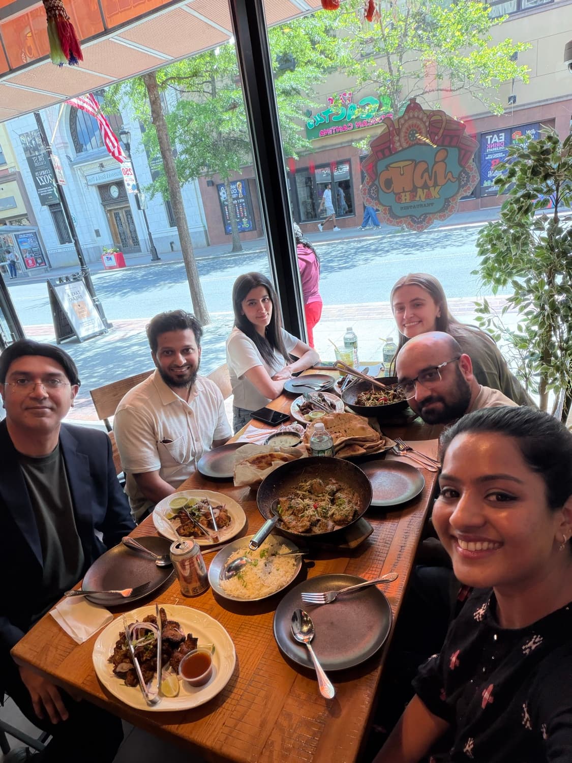 The full Hassan Lab team at a group lunch in New Brunswick.